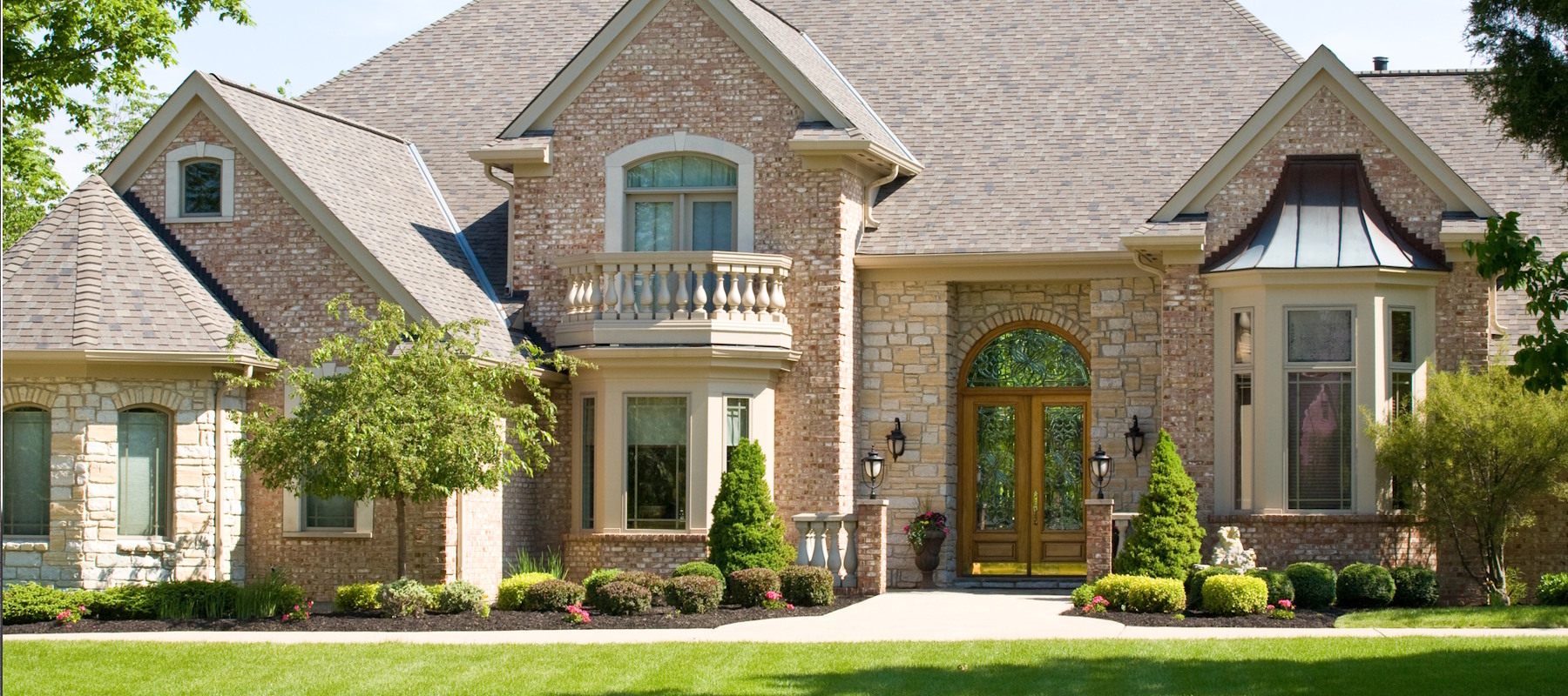 Family in front of new house