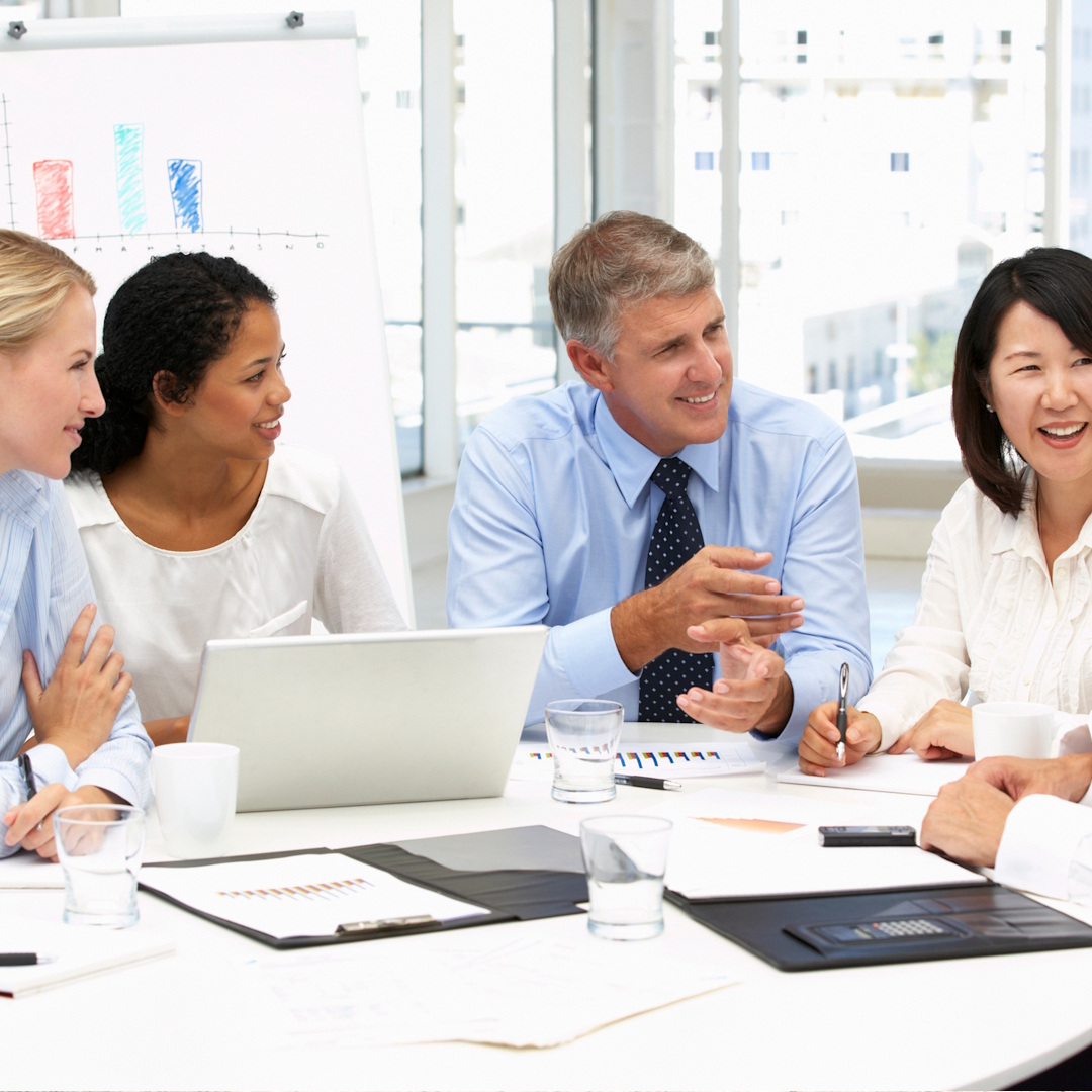 Family standing in front of their home with their dog